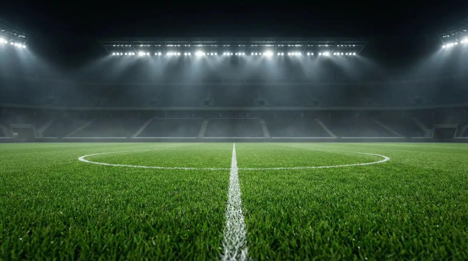 Campo de fútbol iluminado de noche para un partido europeo de Champions League