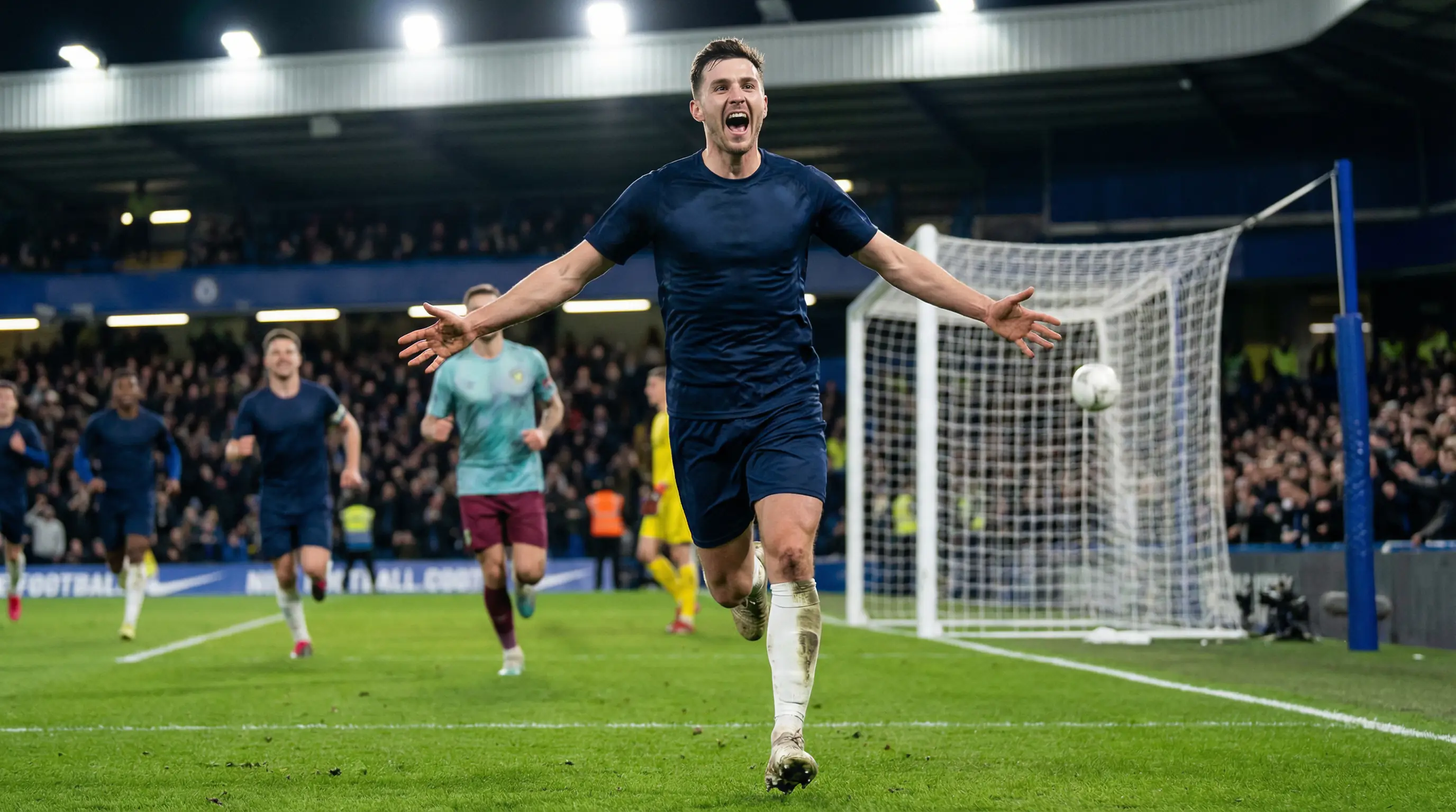 Delantero celebrando un gol en un estadio de fútbol con los brazos abiertos